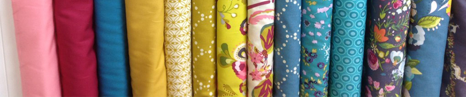 A selection of colourful fabric rolls