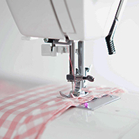 Sewing Machine with needle in fabric